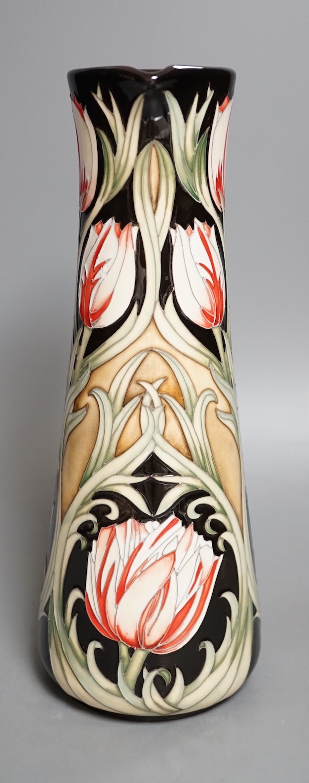 A Moorcroft 'race against time' jug by Paul Hilditch, limited edition 11/40, boxed, 31 cms high.